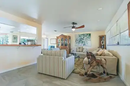 Living room with tile floors and water views